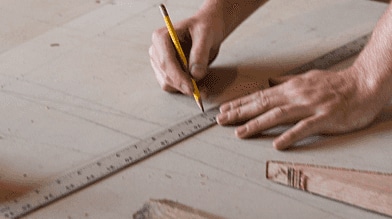 Someone measuring in a workshop