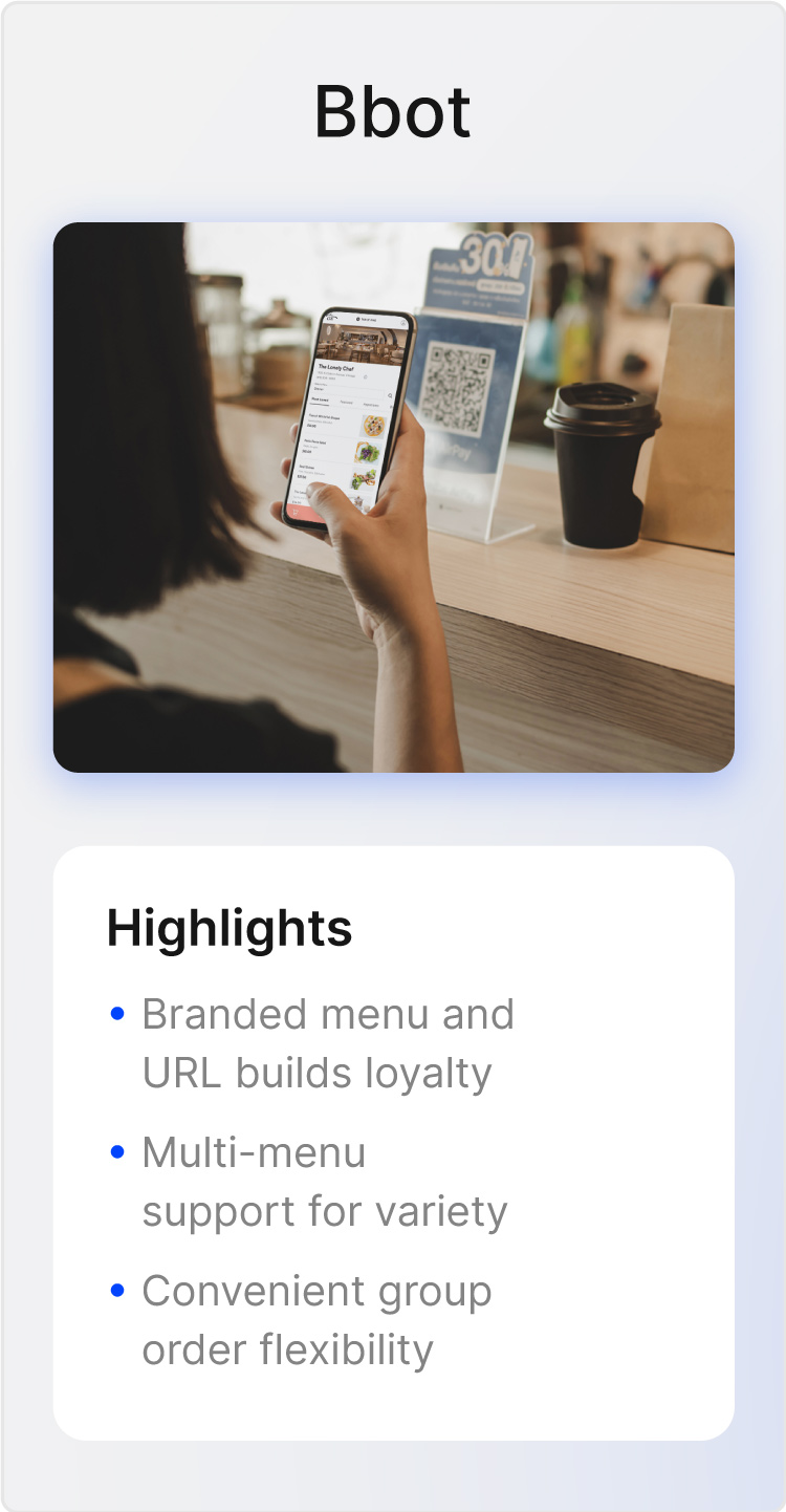 Photo of a phone pulling a mobile menu from a table tent QR code.